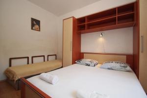 Posteľ alebo postele v izbe v ubytovaní Vita Apartments
