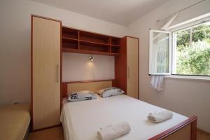 Posteľ alebo postele v izbe v ubytovaní Vita Apartments
