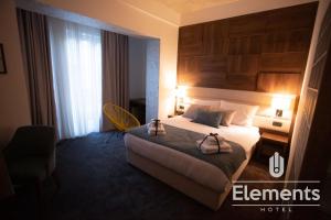 Łóżko lub łóżka w pokoju w obiekcie Hotel Elements