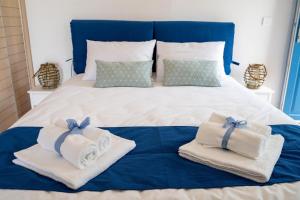 A bed or beds in a room at Seafront Villa Polyxene
