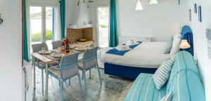 A bed or beds in a room at Seafront Villa Polyxene