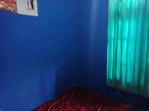 A bed or beds in a room at Amora Homestay