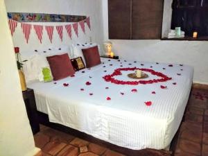 La Loma Hotel Barichara tesisinde bir odada yatak veya yataklar