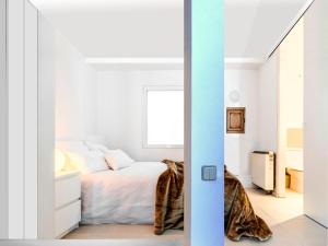 Cama o camas de una habitación en Chueca Apartment