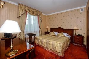 Posteľ alebo postele v izbe v ubytovaní Hotel Żubrówka Spa & Wellness