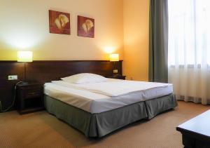 Łóżko lub łóżka w pokoju w obiekcie Hotel Nowodwory