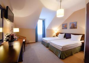 Łóżko lub łóżka w pokoju w obiekcie Hotel Nowodwory