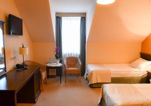 Łóżko lub łóżka w pokoju w obiekcie Hotel Nowodwory