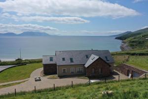 an aerial view of a house with a view of the water at Seascapes in Inch