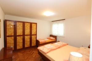 Ένα ή περισσότερα κρεβάτια σε δωμάτιο στο Apartment DamirK