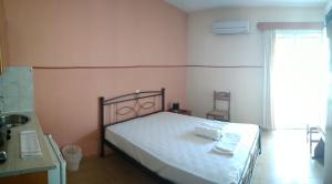 Letto o letti in una camera di Manolia Studios