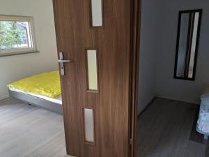 Postel nebo postele na pokoji v ubytování Alex Inn