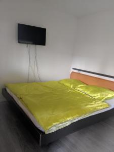 Postel nebo postele na pokoji v ubytování Alex Inn