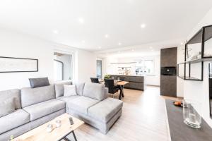 a living room with a couch and a table at Casa Marina in Kulmbach