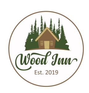 ein Logo für Holzmarmelade in der Unterkunft Wood Inn in Žabljak