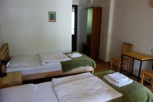 سرير أو أسرّة في غرفة في Guesthouse Mountain View