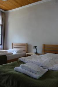 سرير أو أسرّة في غرفة في Guesthouse Mountain View
