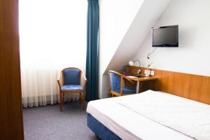 Postel nebo postele na pokoji v ubytování Gästehaus zur Kurve