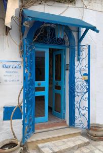 a blue door in the entry to a building at Dar Lola in Houmt Souk
