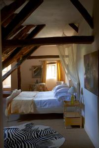 En eller flere senge i et værelse på Mas de Garrigue