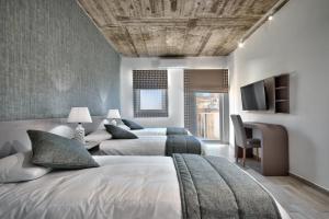 Postel nebo postele na pokoji v ubytování Cozy Rooms Hotel
