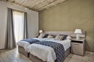 Postel nebo postele na pokoji v ubytování Cozy Rooms Hotel