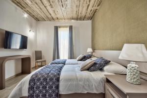 Postel nebo postele na pokoji v ubytování Cozy Rooms Hotel