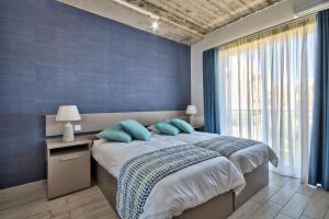 Postel nebo postele na pokoji v ubytování Cozy Rooms Hotel + 15 fotografií