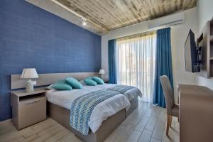 מיטה או מיטות בחדר ב-Cozy Rooms Hotel