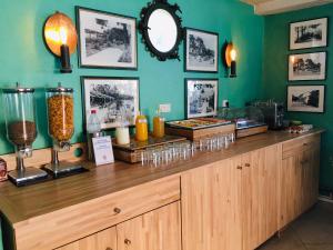 a restaurant with a counter with food on it at Grand Hotel Moriaz in Le Lavandou