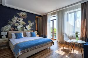 Postel nebo postele na pokoji v ubytování Redling Hotel