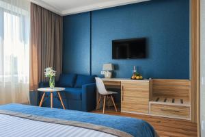 Postel nebo postele na pokoji v ubytování Redling Hotel