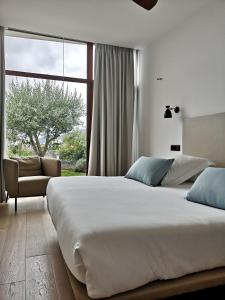 Posteľ alebo postele v izbe v ubytovaní Hotel Herbeira