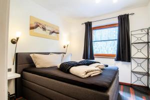 Posteľ alebo postele v izbe v ubytovaní Ferienhaus Monte Bianco