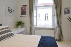 Posteľ alebo postele v izbe v ubytovaní Apartment Arum-Lily