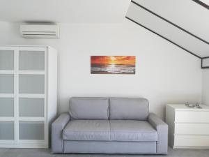a living room with a couch and a window at Villa Adagio Apartments in Sumartin