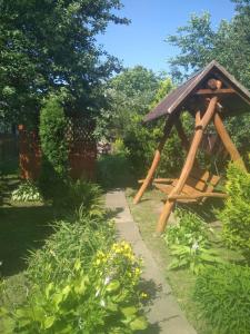 a garden with a gazebo in the grass at Садиба у Богдана in Skole