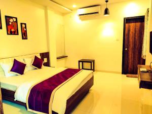 Voodi või voodid majutusasutuse Hotel Neem Tree toas