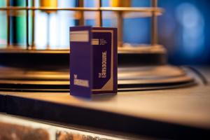 a book sitting on a table in a library at The Lansdowne Hotel in Belfast