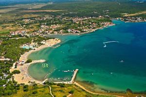 an aerial view of a beach with boats in the water at Atena Zaton 2 in Nin