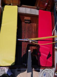 a group of twoartments of a boat with red and yellow at Margarethe in Marina di Pisa