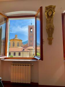 a window with a view of a building at PRIONE173 City Center in La Spezia