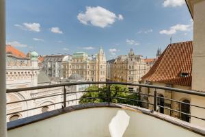 a view of the city from a balcony at Gold Art Apartments in Prague