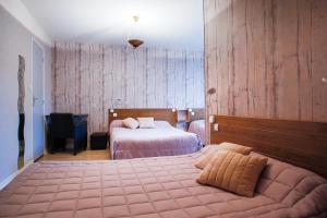 Łóżko lub łóżka w pokoju w obiekcie Entre Mer et Montagne