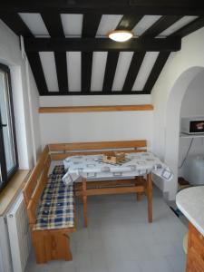 a room with a bed and a table in it at Cyklo ubytování a vinný sklep Žádovice in Žádovice