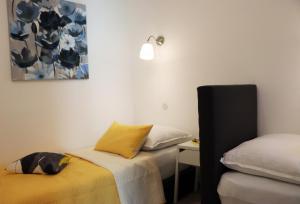 Postel nebo postele na pokoji v ubytování Apartman Muracca