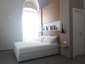 Postel nebo postele na pokoji v ubytování Muragie del Castello B&B