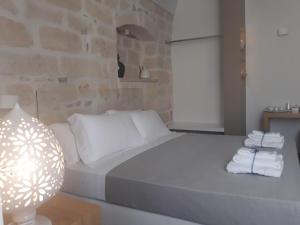 Postel nebo postele na pokoji v ubytování Muragie del Castello B&B