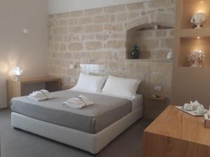 Postel nebo postele na pokoji v ubytování Muragie del Castello B&B