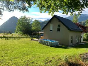 a house with a swimming pool in a yard at Haus Rading in Rading